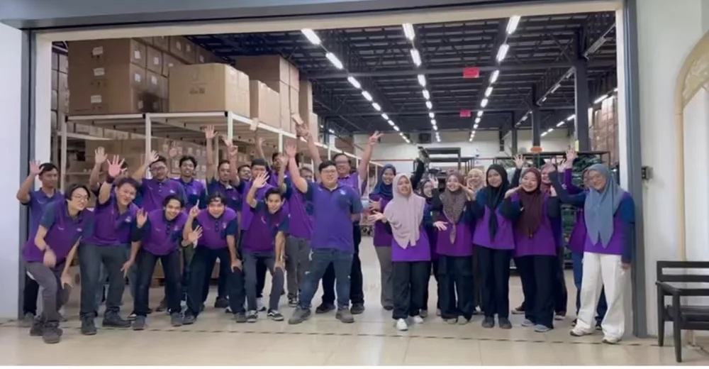 A team gathering from the 2026 warehouse photo archive.